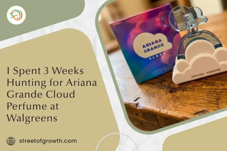 Ariana Grande Cloud Perfume bottle sitting in its white cloud holder next to the purple holographic box on a grey surface.