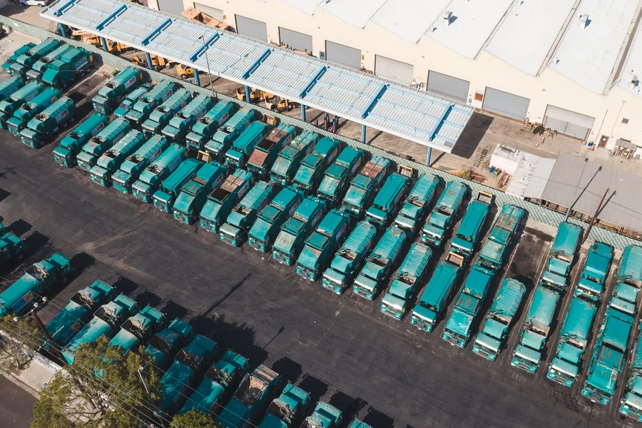 Commercial fleet trucks parked at a depot ready for predictive maintenance inspection