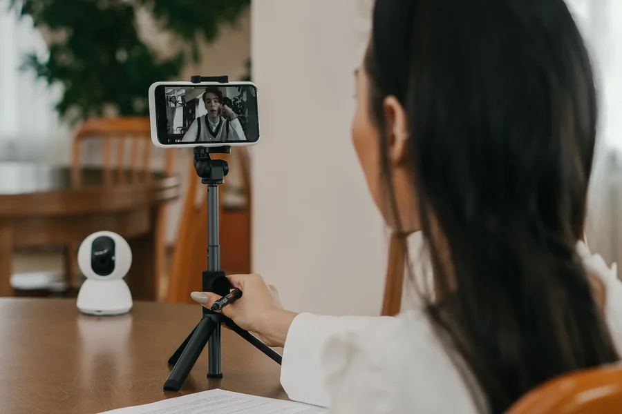 Live augmented reality repair session guiding hands on a home appliance by phone