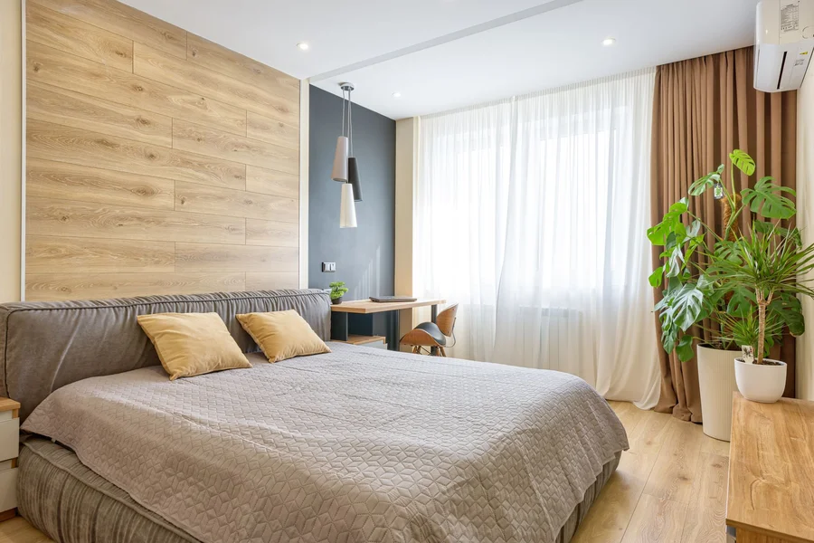 Finished Room Style Cozy decorated bedroom with plants and warm lighting showing a finished design direction