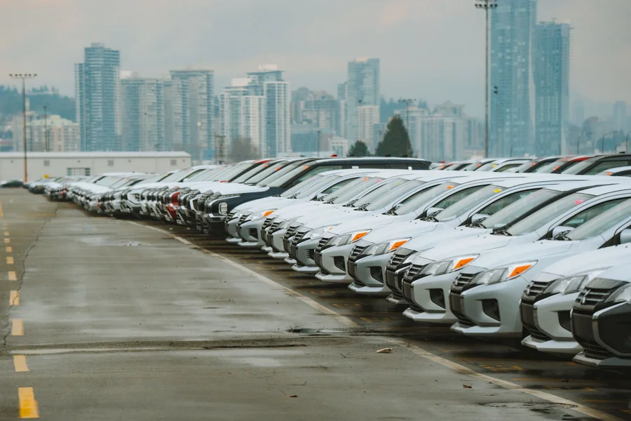 Fleet vehicles at rental lot Fleet of rental vehicles parked in a lot ready for AI-powered condition inspection