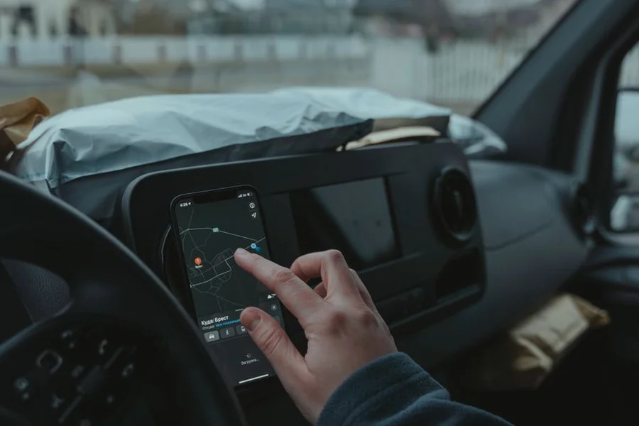 GPS route optimization app Person using smartphone GPS navigation map for optimized route planning